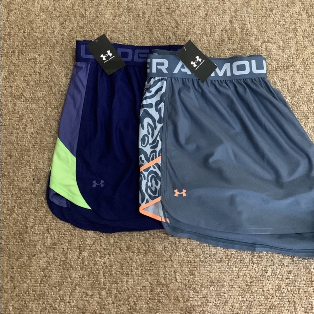 - 2 Pairs of under armor shorts. They are both size 3X